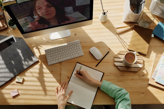 lesson planning on pc on table by a girl